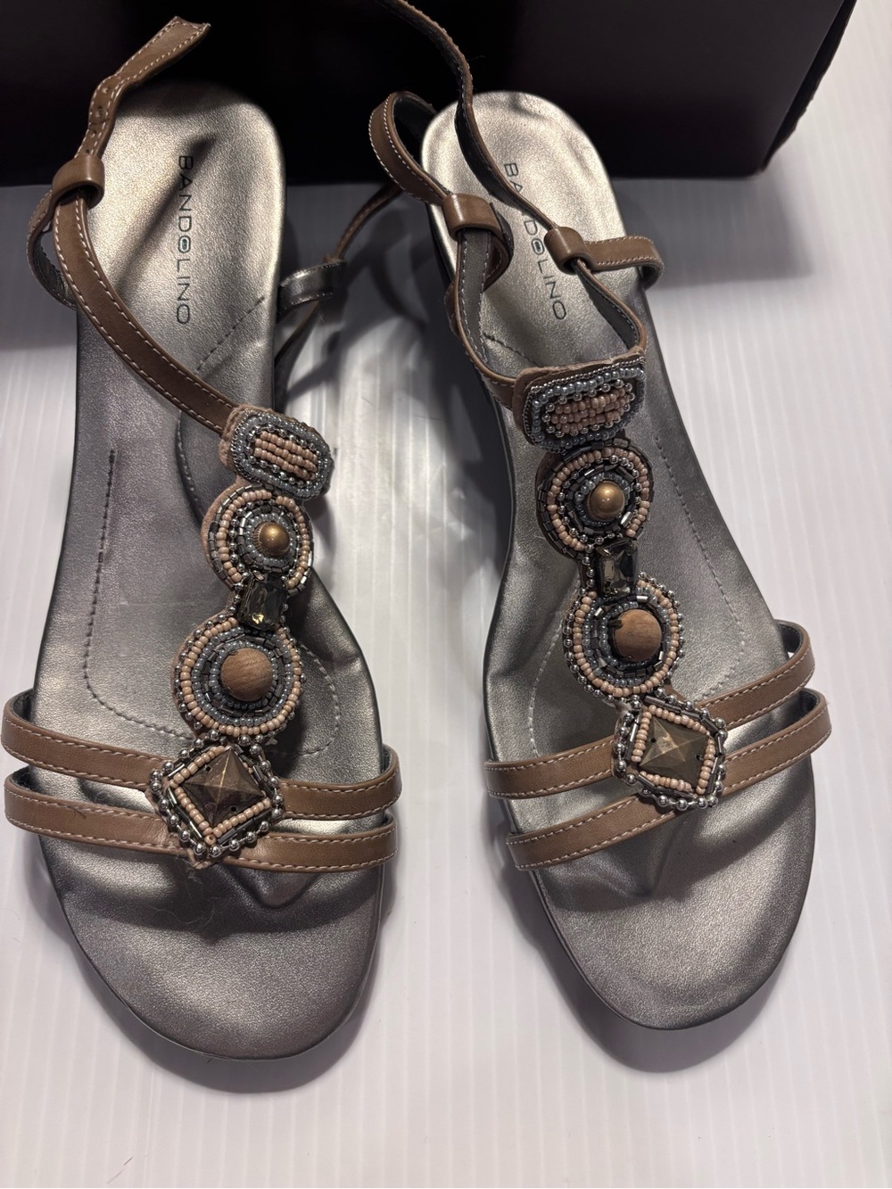 Bandolino Brown Beaded T-Strap Sandals with Metallic Footbed